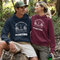 Introducing the perfect hoodie for all your outdoor adventures! This gender-neutral hoodie with a camping theme and Manitoba on it is the ultimate companion for all your camping trips.